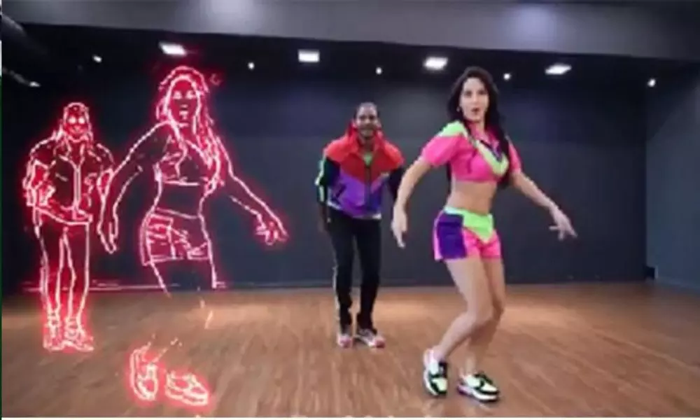 అదిరేటి స్టెప్పులేసి మెస్మరైజ్ చేసిన మొరాకో బ్యూటీ నోరా అదిరేటి స్టెప్పులేసి మెస్మరైజ్ చేసిన మొరాకో బ్యూటీ నోరా