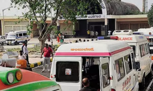 Bengaluru: Family Members wait for the Funeral of a COVID-19 Victim Bengaluru: Family Members wait for the Funeral of a COVID-19 Victim