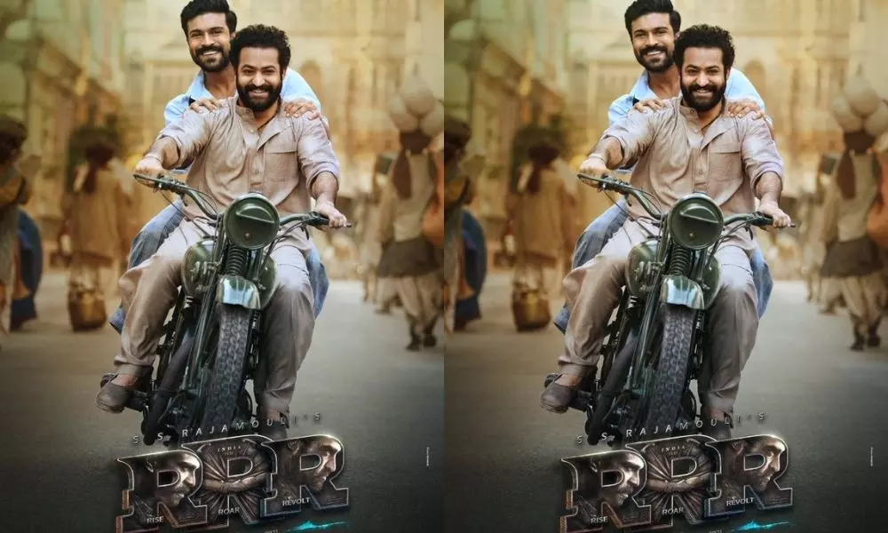 Rajamouli Says RRR Shooting Completed Except 2 Songs and Released Ram Charan Jr Ntr Poster on Same Bike
