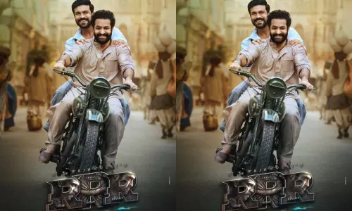 Rajamouli Says RRR Shooting Completed Except 2 Songs and Released Ram Charan Jr Ntr Poster on Same Bike