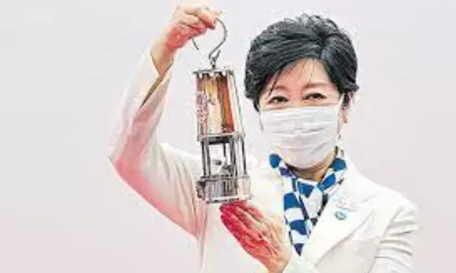 Without runners, Olympic torch relay gets off to muted start in Tokyo