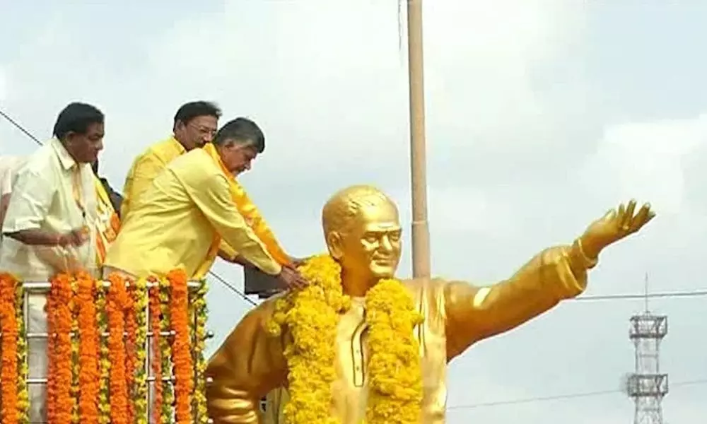 Chandrababu Pays Tribute to the NTR Statue in Vijayawada