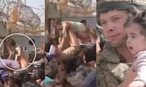 Parents Handing Their Children Over to Foreign Soldiers Over Barbed Fire Fence in Afghanistan Parents Handing Their Children Over to Foreign Soldiers Over Barbed Fire Fence in Afghanistan