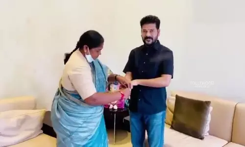 MLA Seethakka Ties Rakhi to TPCC Chief Revanth Reddy MLA Seethakka Ties Rakhi to TPCC Chief Revanth Reddy