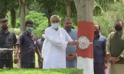 Bihar Chief Minister Nitish Kumar Ties Rakhi To Trees