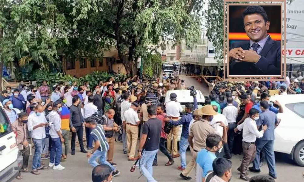Fans of Actor Puneeth Rajkumar Gather Outside Vikram Hospital