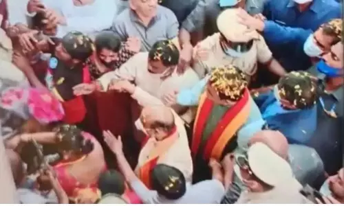 A Woman Kisses Karnataka CM Basavaraj Bommai in Bangalore A Woman Kisses Karnataka CM Basavaraj Bommai in Bangalore