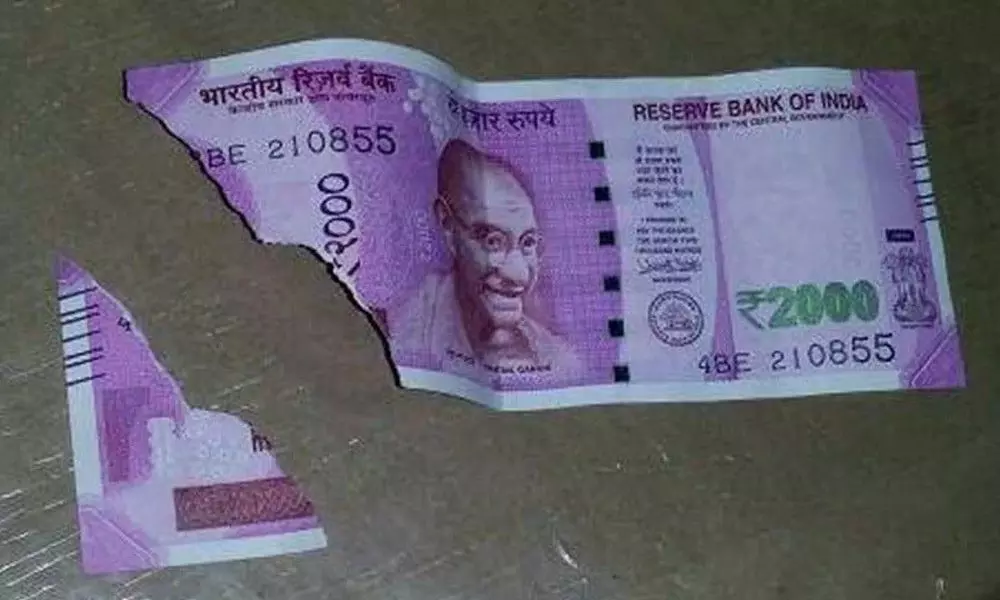 You can go to SBI Bank and Exchange the Soiled or Mutilated Notes