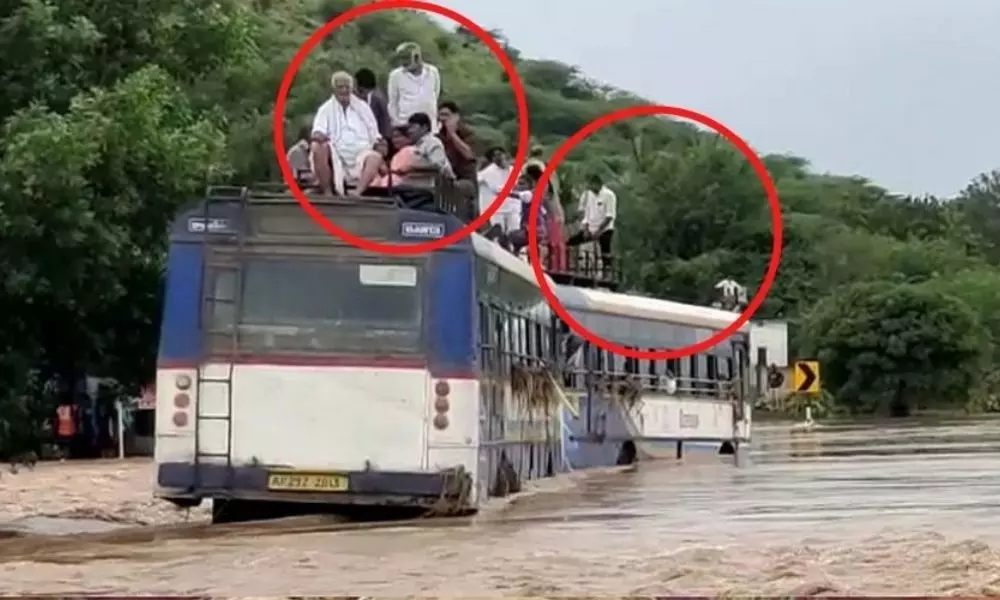 Two RTC Buses Struck in Flood Water at Rajampet
