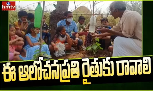 Ideal Farmer Giving Agricultural Training To School Children