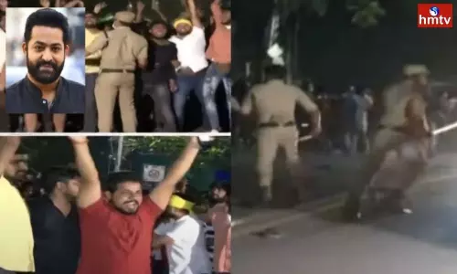 Fans Cut the Cake in Front of the NTR House at Midnight Fans Cut the Cake in Front of the NTR House at Midnight