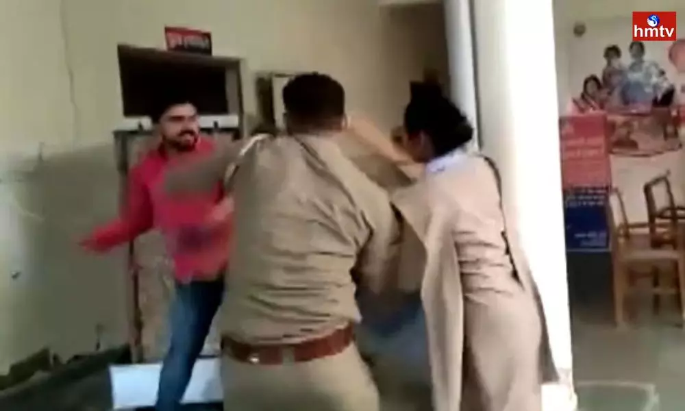 Young Man  Beats Police official Inside a Police Station Premises in Mianpuri UP