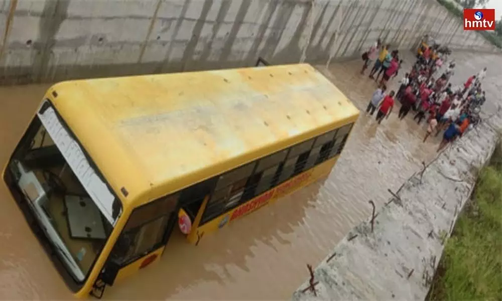 School Bus Submerges in Flooded Street in Mahbubnagar