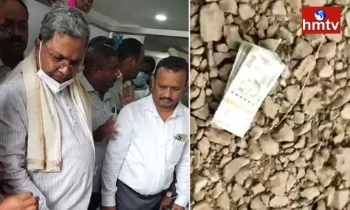Woman Throws Away Rs 2 Lakh Compensation by Siddaramaiah Woman Throws Away Rs 2 Lakh Compensation by Siddaramaiah