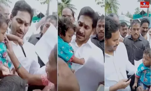 CM Jagan Gave a Pen as a Gift to 8 Month Baby CM Jagan Gave a Pen as a Gift to 8 Month Baby