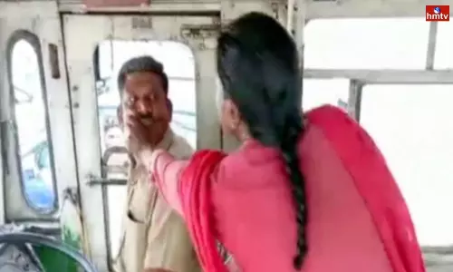 Woman Attacked on RTC Bus Driver In Vijayawada Woman Attacked on RTC Bus Driver In Vijayawada