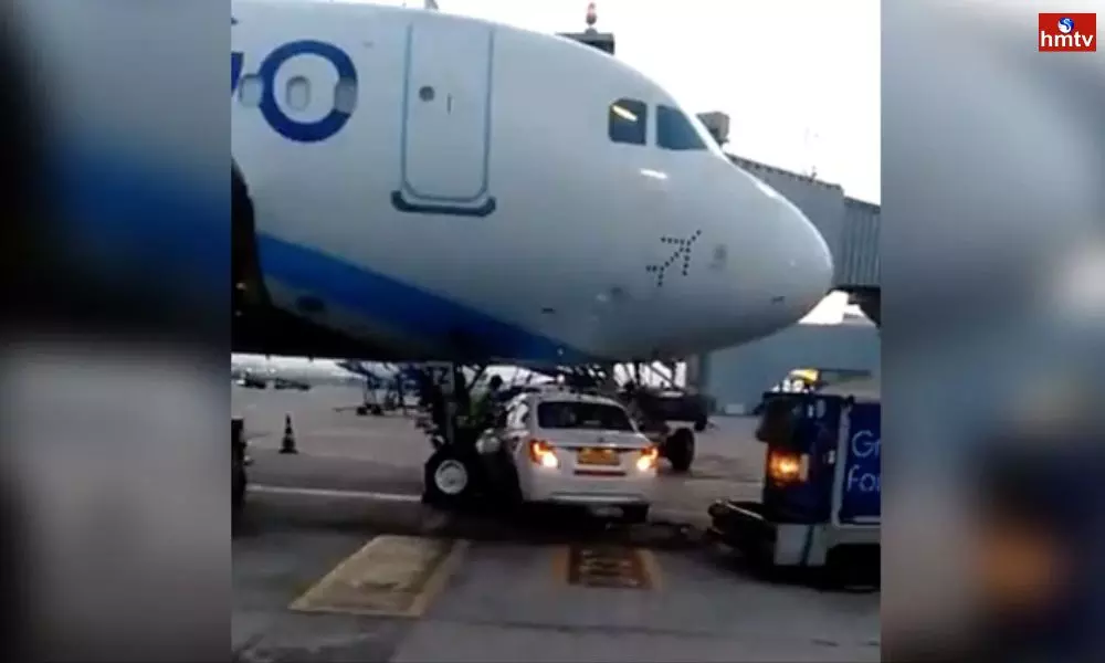 Go First Car Passes Under IndiGo Plane