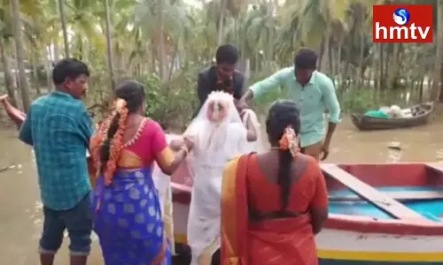 New Couple Faced Floods Problems At SakhinetiPalli In Konaseema District New Couple Faced Floods Problems At SakhinetiPalli In Konaseema District