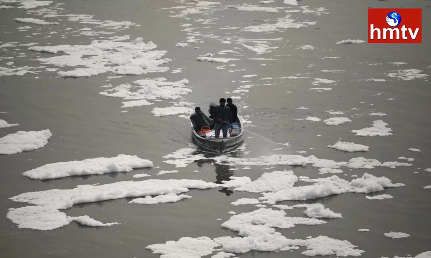 a thick layer of poisonous foam form over the river Yamuna