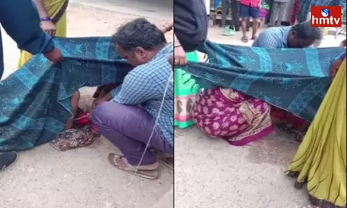 pregnant woman gave birth to a baby on the road in tirupati pregnant woman gave birth to a baby on the road in tirupati