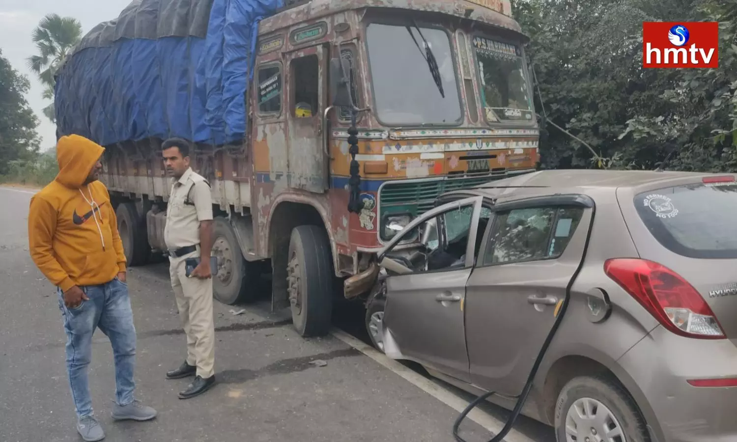 Road Accident In Nizamabad District.. A Car Hit The Lorry Coming From The Opposite Side