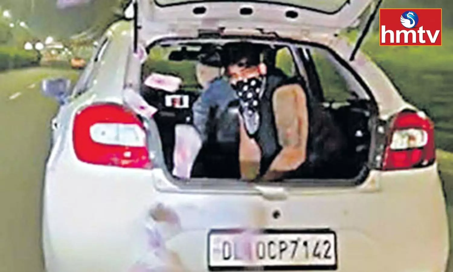 A Young Man Throw Currency Notes From the Car