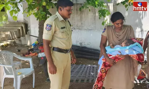 Policewoman Caressing A Crying 3Month Old Baby