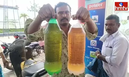 Expressing Anger that Water is being added to Petrol in Jagtial District Expressing Anger that Water is being added to Petrol in Jagtial District