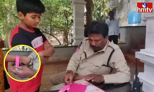 Staff Putting Tags On Kids Hands Near Mile 7 In Tirumala Nadaka Route