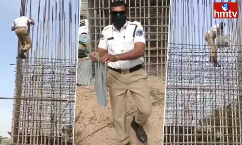 Traffic Constable Rescued Cat Which Is Stuck In Iron Rods In Hyderabad Traffic Constable Rescued Cat Which Is Stuck In Iron Rods In Hyderabad