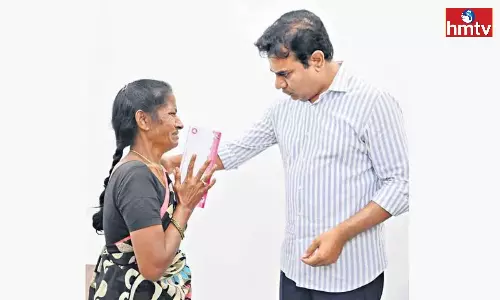 KTR Hands Over Rs 1 Lakh To A Woman For Her Daughter Education KTR Hands Over Rs 1 Lakh To A Woman For Her Daughter Education
