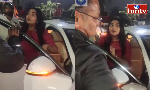 Woman Veerangam on Traffic Home Guard in Banjara Hills Woman Veerangam on Traffic Home Guard in Banjara Hills