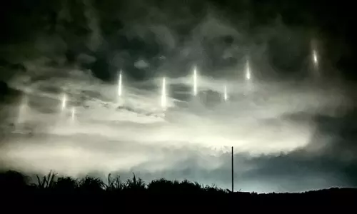 Vertical Lights Appear In Night Sky In Japan