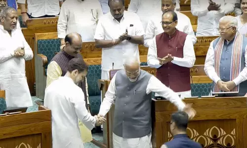 PM Modi Shakes Hands With Rahul Gandhi In Parliament PM Modi Shakes Hands With Rahul Gandhi In Parliament