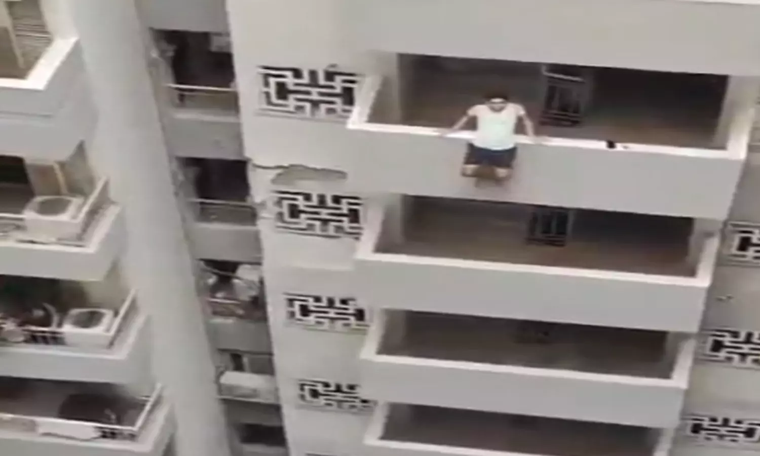 A Young Man From Noida Trying to Jump From Apartment Video Goes Viral in Social Media