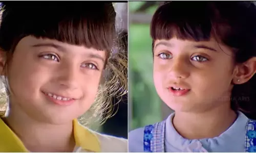 Can you guess who is this child artist in this photo