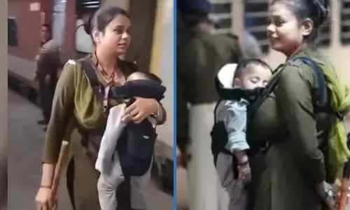 RPF woman constable seen taking care of her baby while doing duty at New Delhi Railway station working women video goes viral